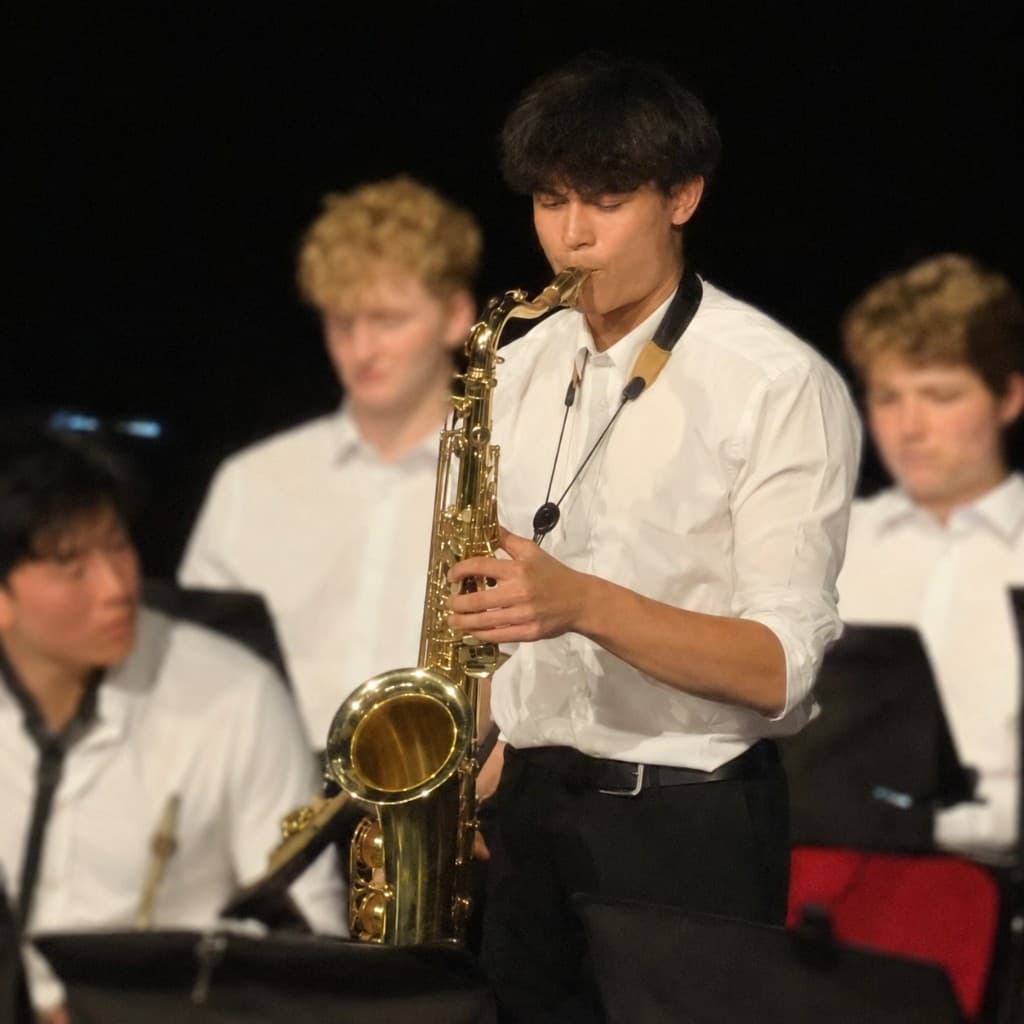 Anson Chan playing saxophone, co-founder of ESAT Camp